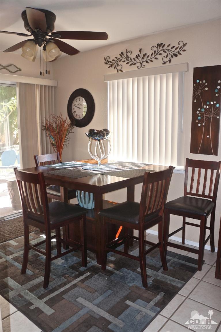 80928 Rio Grande Avenue Indio, CA 92201 - Photo 4 of 25 a view of a dining table and chairs in a room