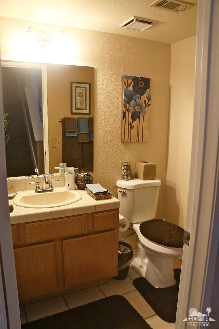 80928 Rio Grande Avenue Indio, CA 92201 - Photo 7 of 25 a bathroom with a sink and a toilet