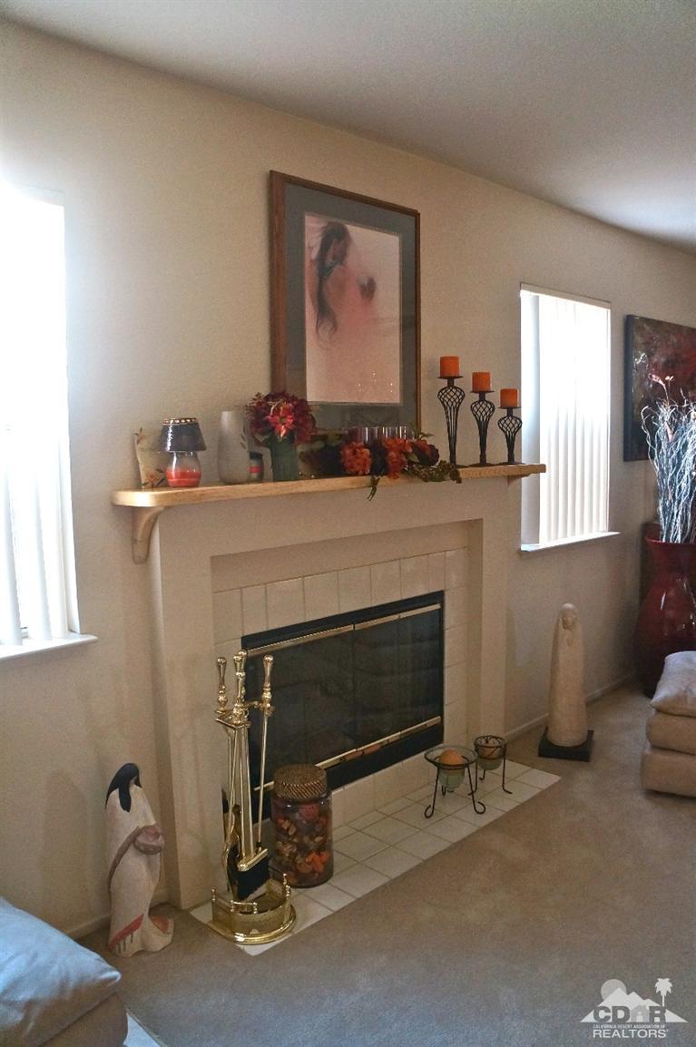 80928 Rio Grande Avenue Indio, CA 92201 - Photo 8 of 25 a living room with furniture and a fireplace