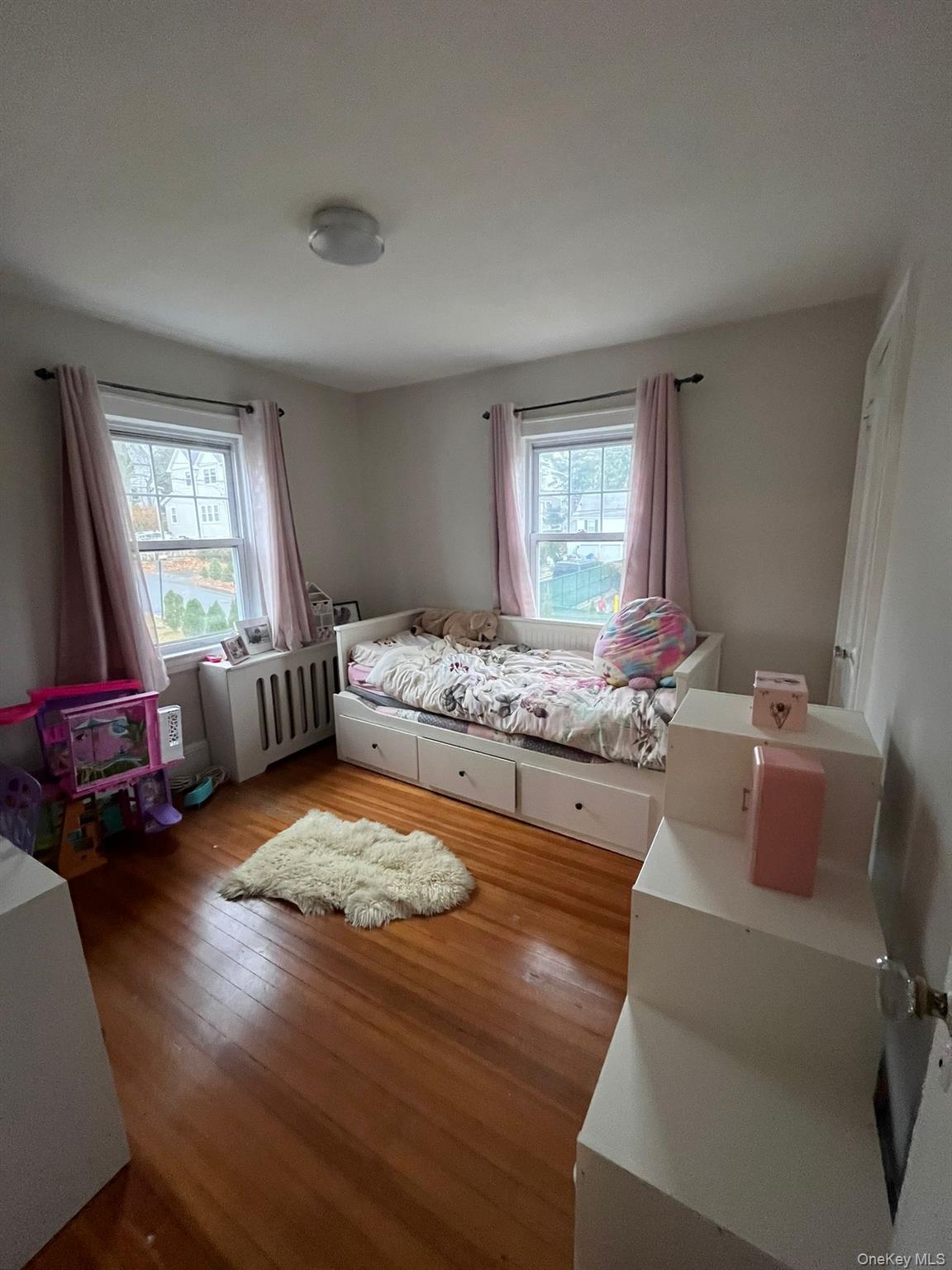 14 Redbrook Road Great Neck, NY 11024 - Photo 13 of 20 a bedroom with furniture and window