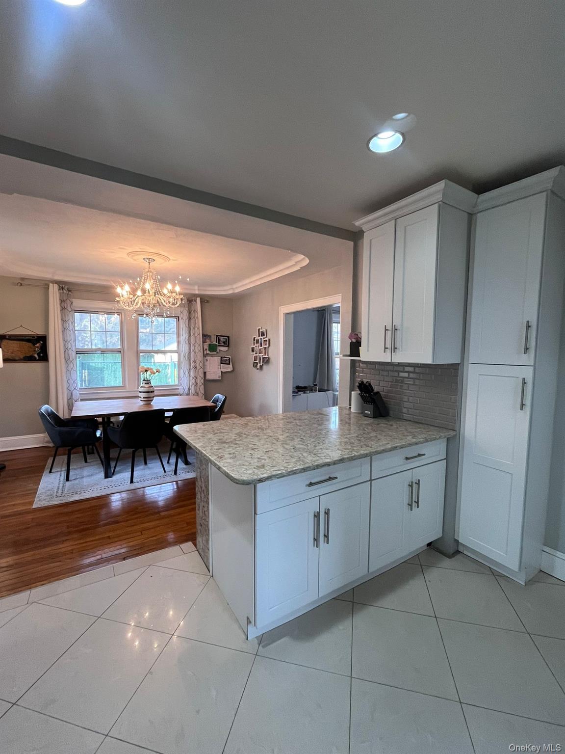 14 Redbrook Road Great Neck, NY 11024 - Photo 3 of 20 a kitchen with stainless steel appliances granite countertop a stove top oven a sink dishwasher and cabinets with granite countertops
