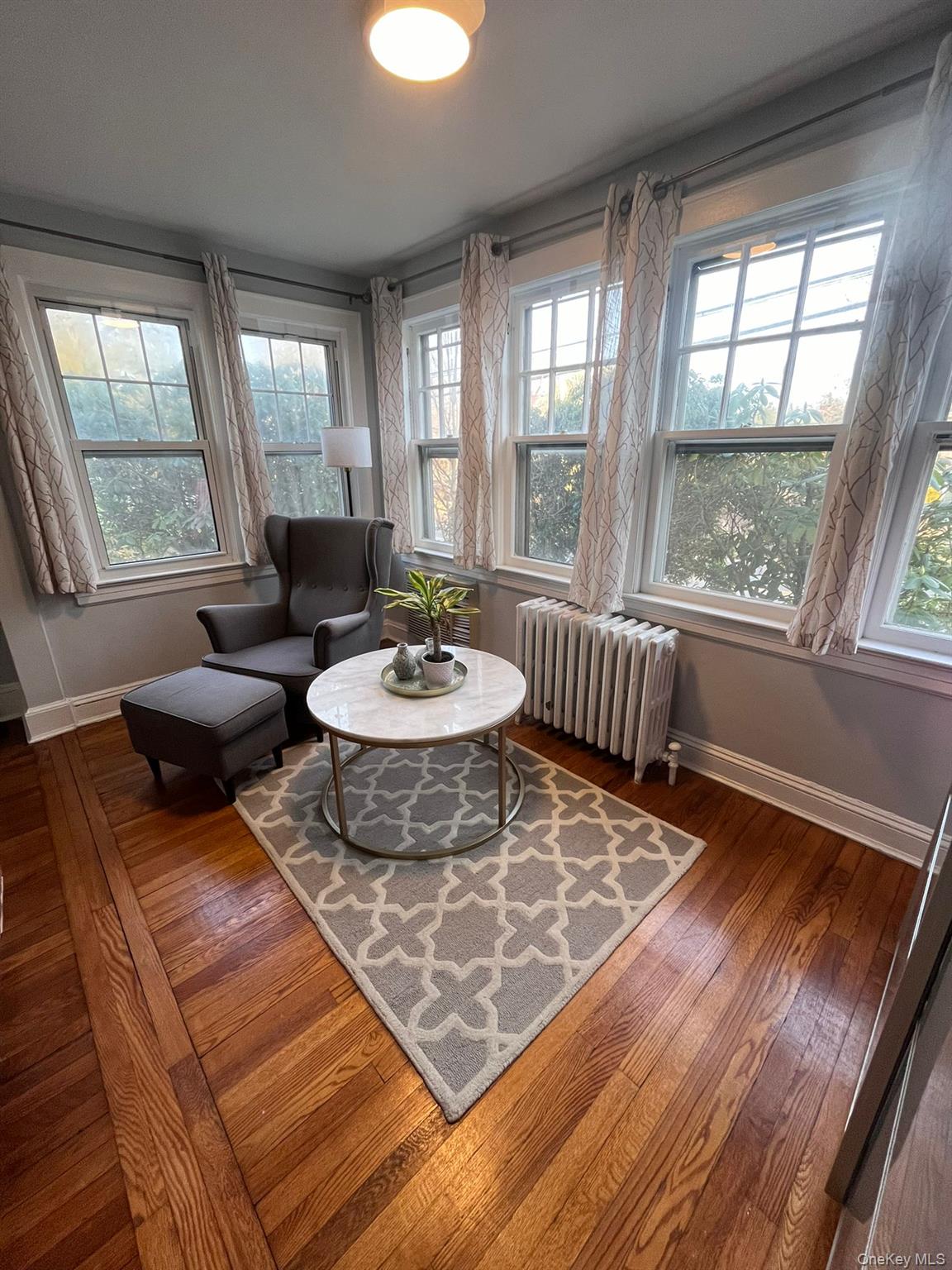 14 Redbrook Road Great Neck, NY 11024 - Photo 9 of 20 a living room with furniture and a table