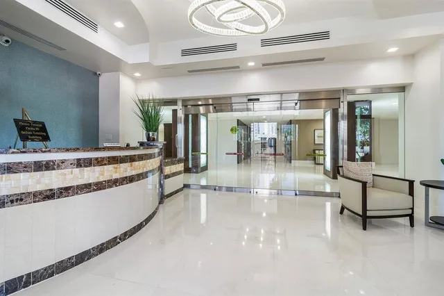 a view of a hallway with an entryway