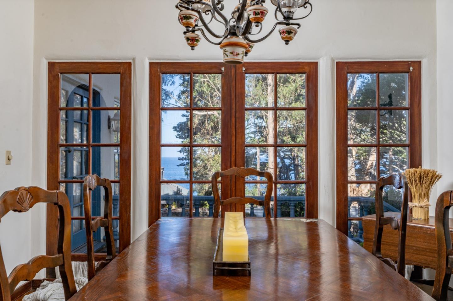 161 Spindrift Road Carmel, CA 93923 - Photo 1 of 20 a dining room with wooden floor book shelves
