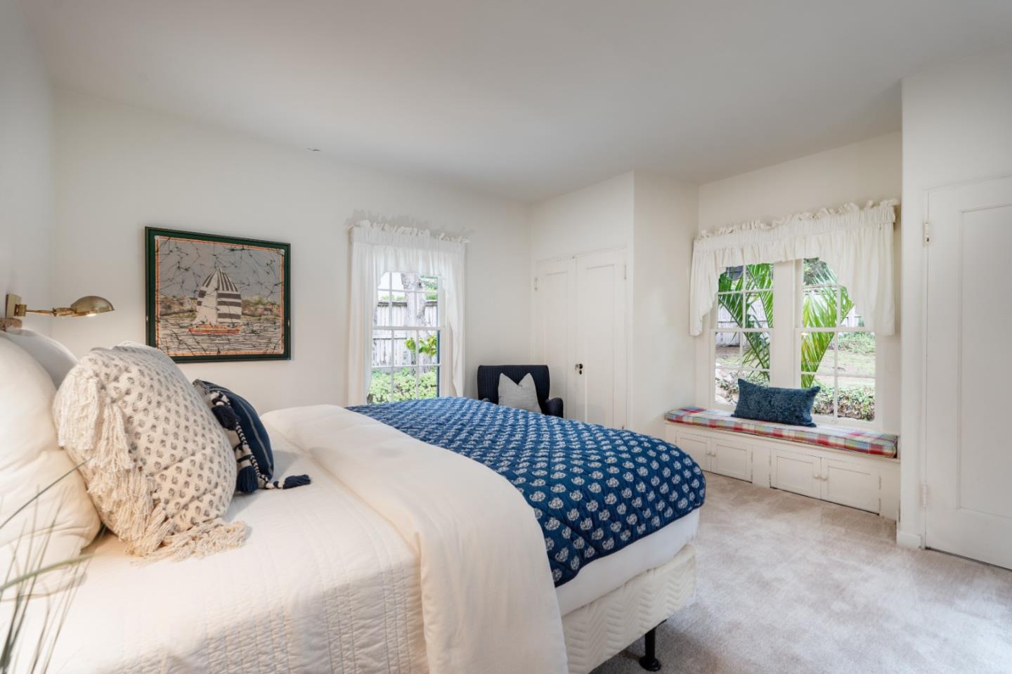 161 Spindrift Road Carmel, CA 93923 - Photo 14 of 20 a bedroom with a large bed and a window