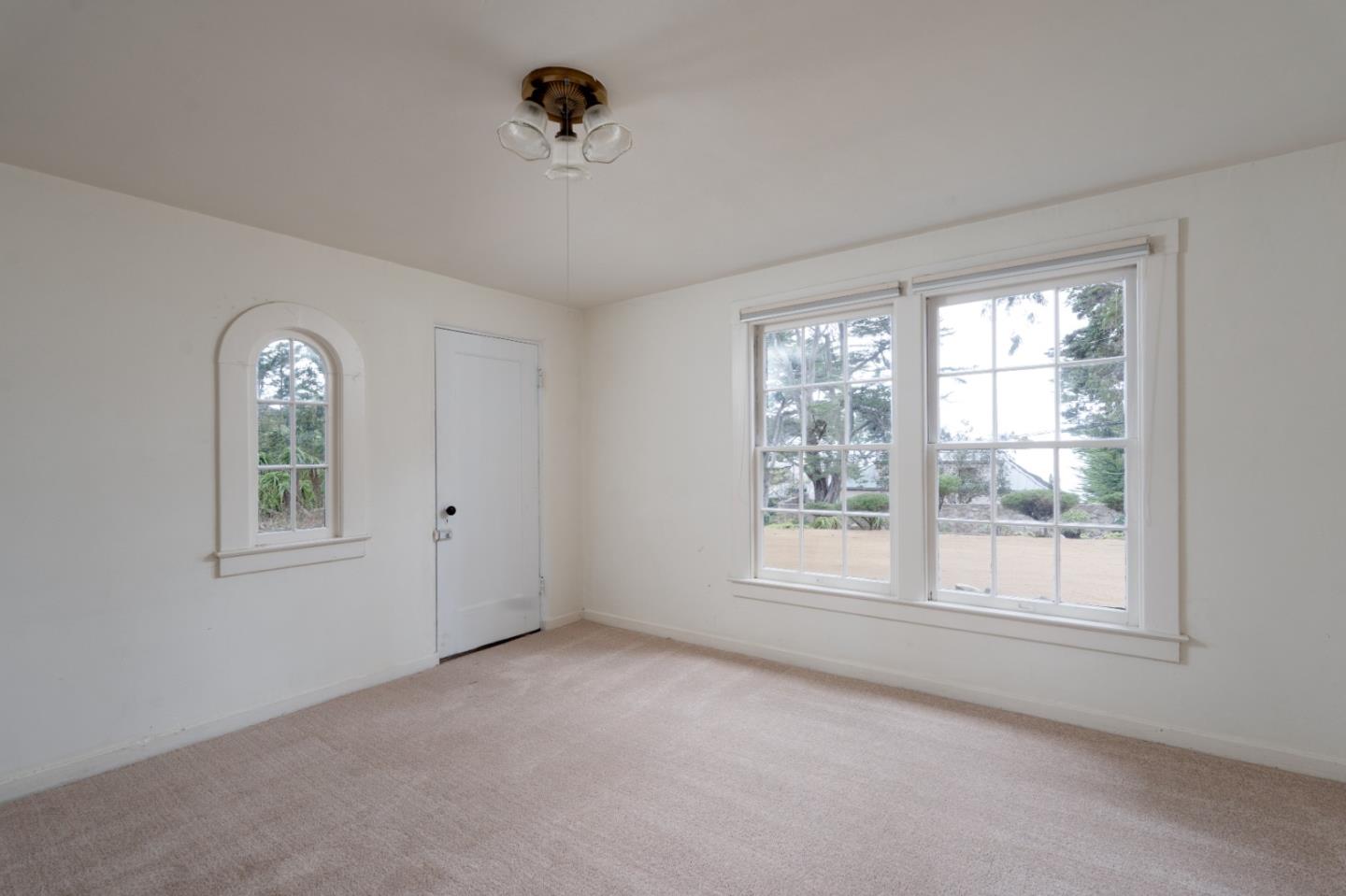 161 Spindrift Road Carmel, CA 93923 - Photo 17 of 20 a view of an empty room with a window