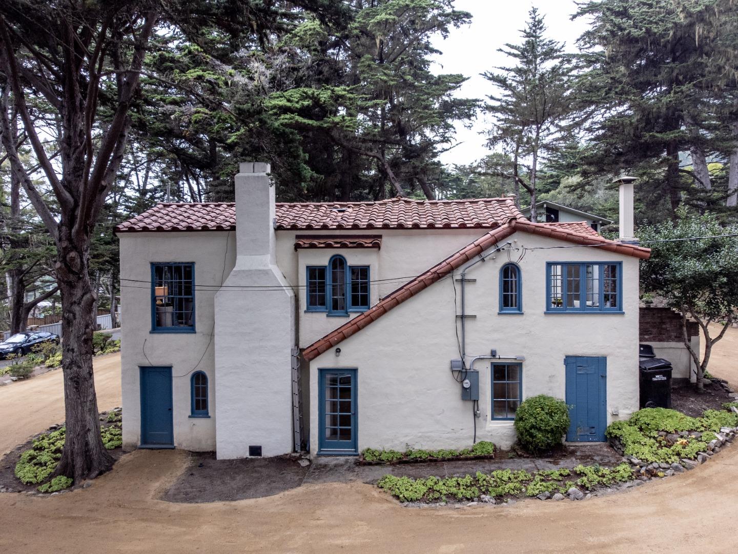 161 Spindrift Road Carmel, CA 93923 - Photo 18 of 20 a white house that has a tree in front of it