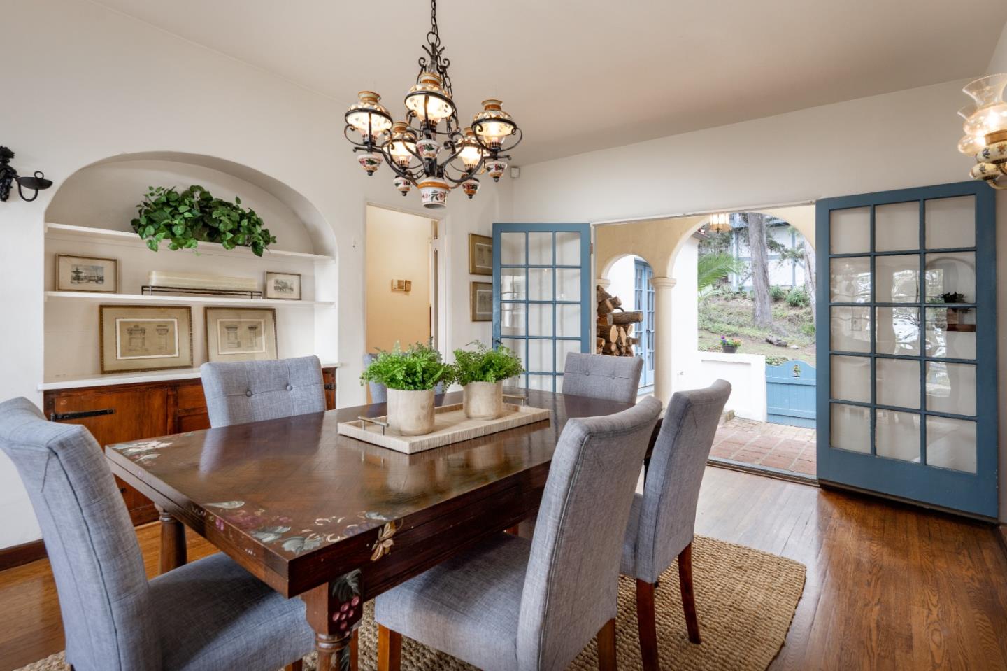 161 Spindrift Road Carmel, CA 93923 - Photo 5 of 20 a view of a dining room with furniture wooden floor and chandelier
