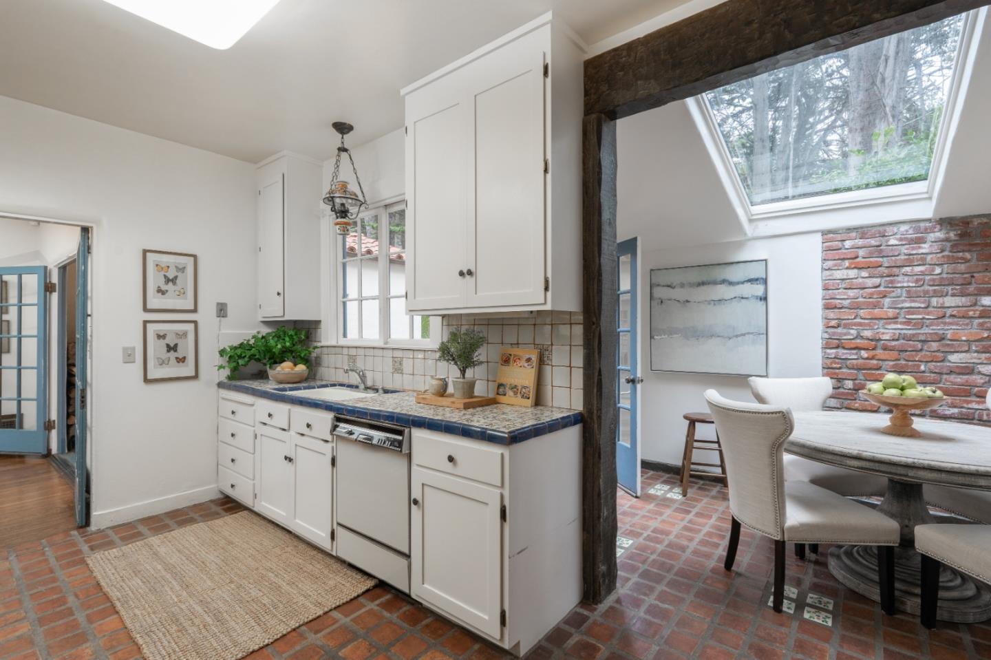 161 Spindrift Road Carmel, CA 93923 - Photo 9 of 20 a kitchen with a sink and cabinets