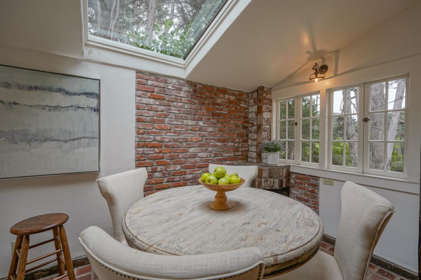 161 Spindrift Road Carmel, CA 93923 - Photo 10 of 20 a view of a dining room with furniture a chandelier and wooden floor