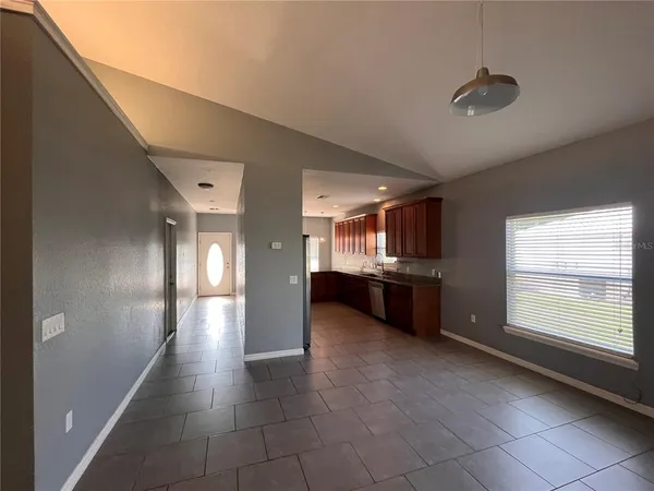 a view of a big room with closet and windows
