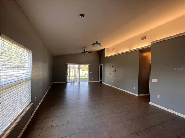 a view of a hallway with windows