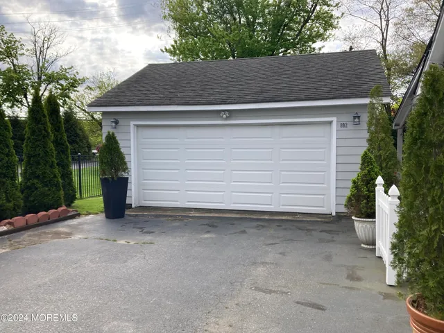 a view of backyard and tree