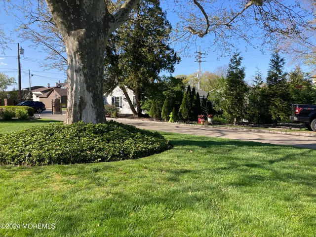 a view of swimming pool with a yard