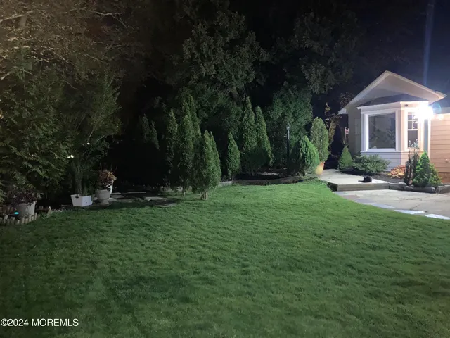 a view of a garden and basketball court