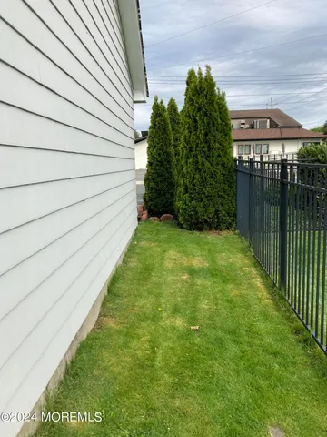 a view of swimming pool with a backyard