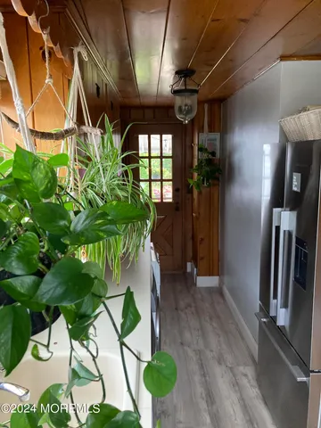 a view of entryway with wooden floor