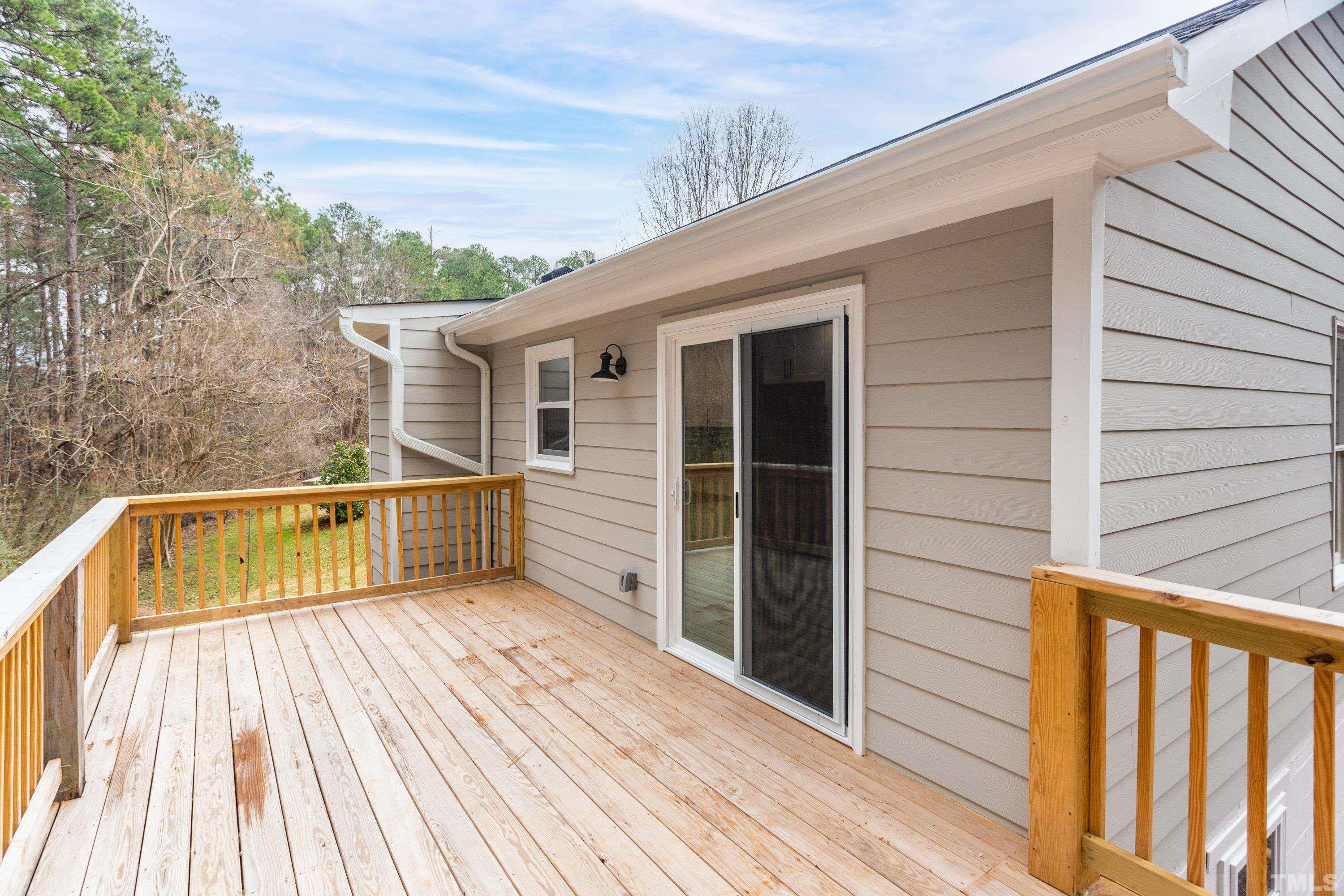 721 Habersham Place Raleigh, NC 27610 - Photo 32 of 38 a view of balcony with deck and wooden floor