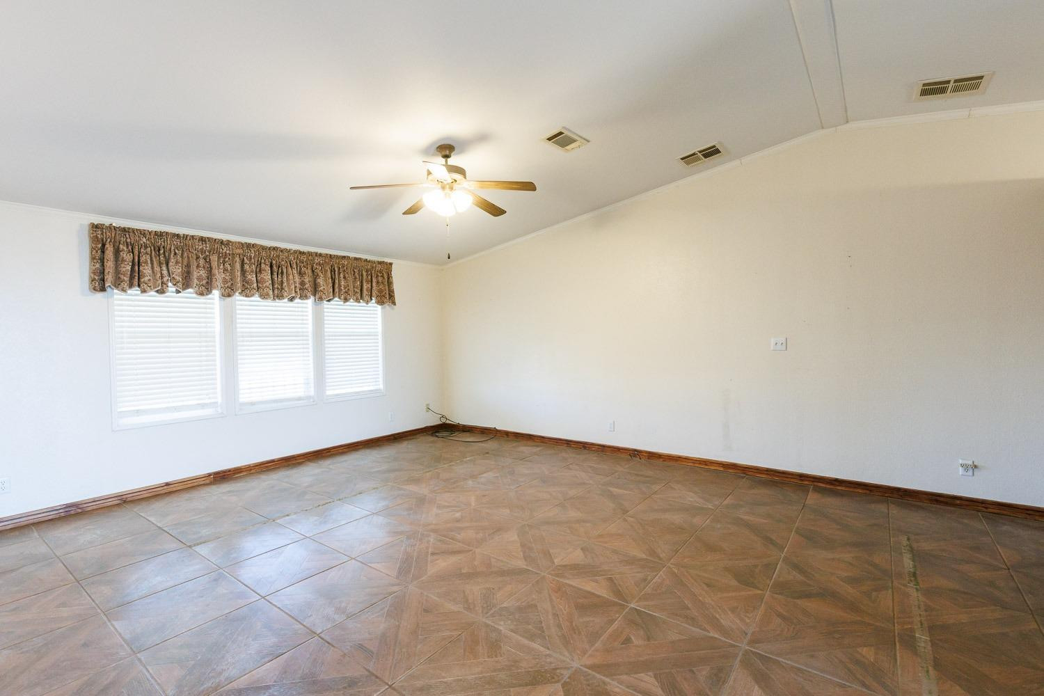 6111 Foster Road Ropesville, TX 79358 - Photo 8 of 48 a view of an empty room with a window