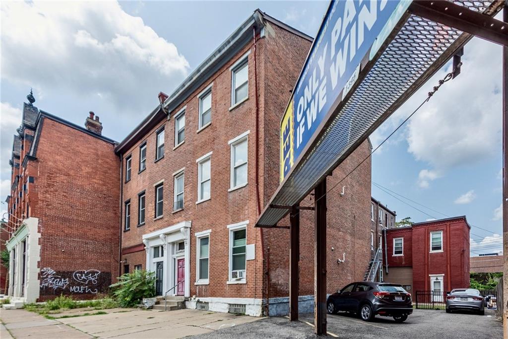 a car parked in front of brick building