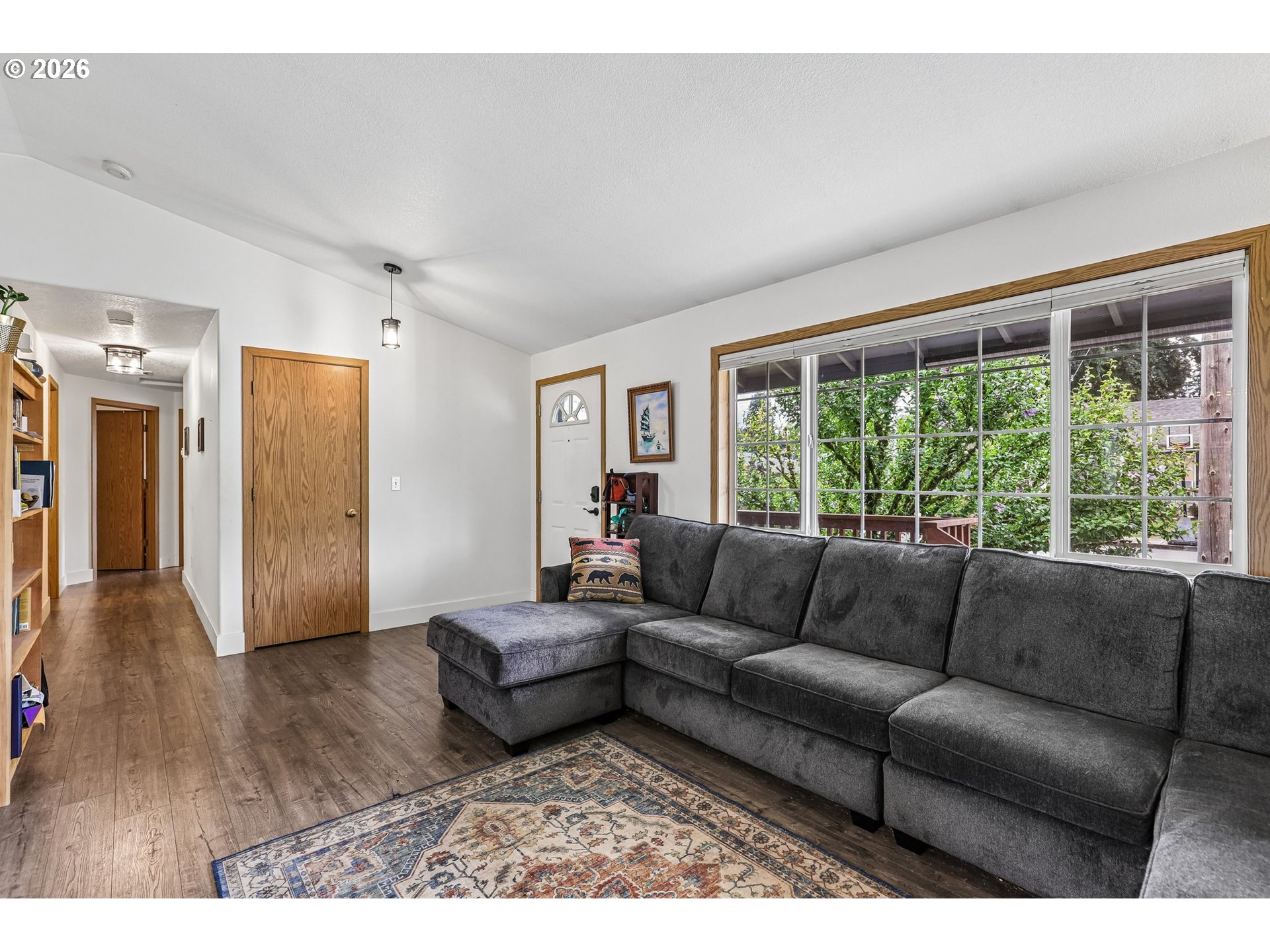 608 Southeast Sumner Street Camas, WA 98607 - Photo 6 of 39 a living room with furniture and a large window
