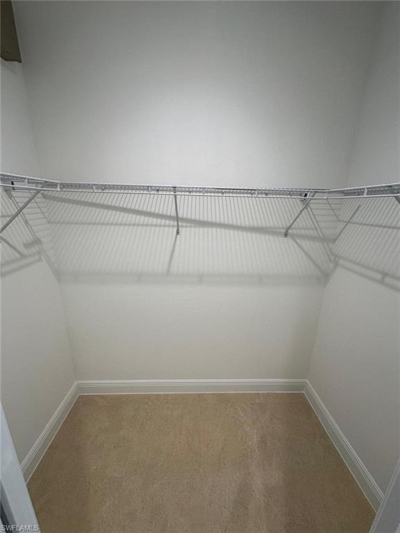 2167 Della Drive Naples, FL 34117 - Photo 11 of 17 a view of a room with racks on the wall