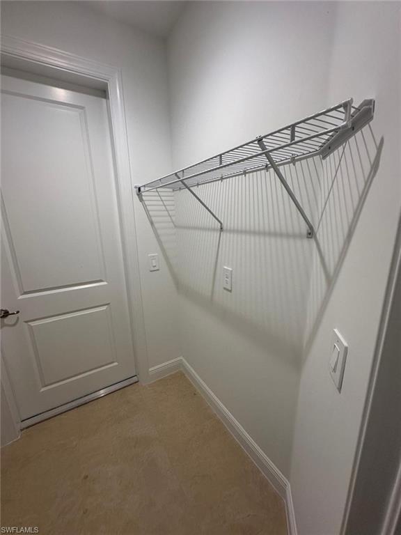 2167 Della Drive Naples, FL 34117 - Photo 17 of 17 a view of a room with racks on the wall