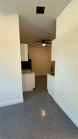 a spacious bathroom with a toilet sink and mirror