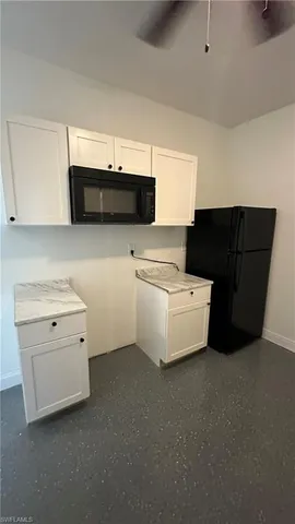 a kitchen that has a sink and a stove