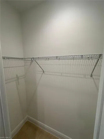 a view of a room with racks on the wall