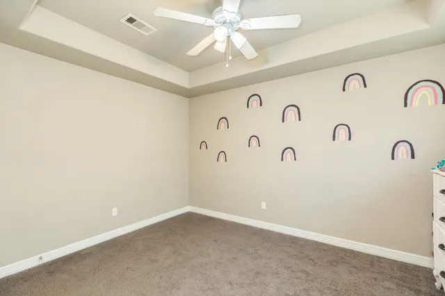 a bathroom with a sink a toilet a mirror and shower curtain