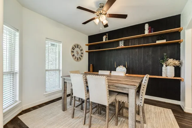 a dining room with furniture and window