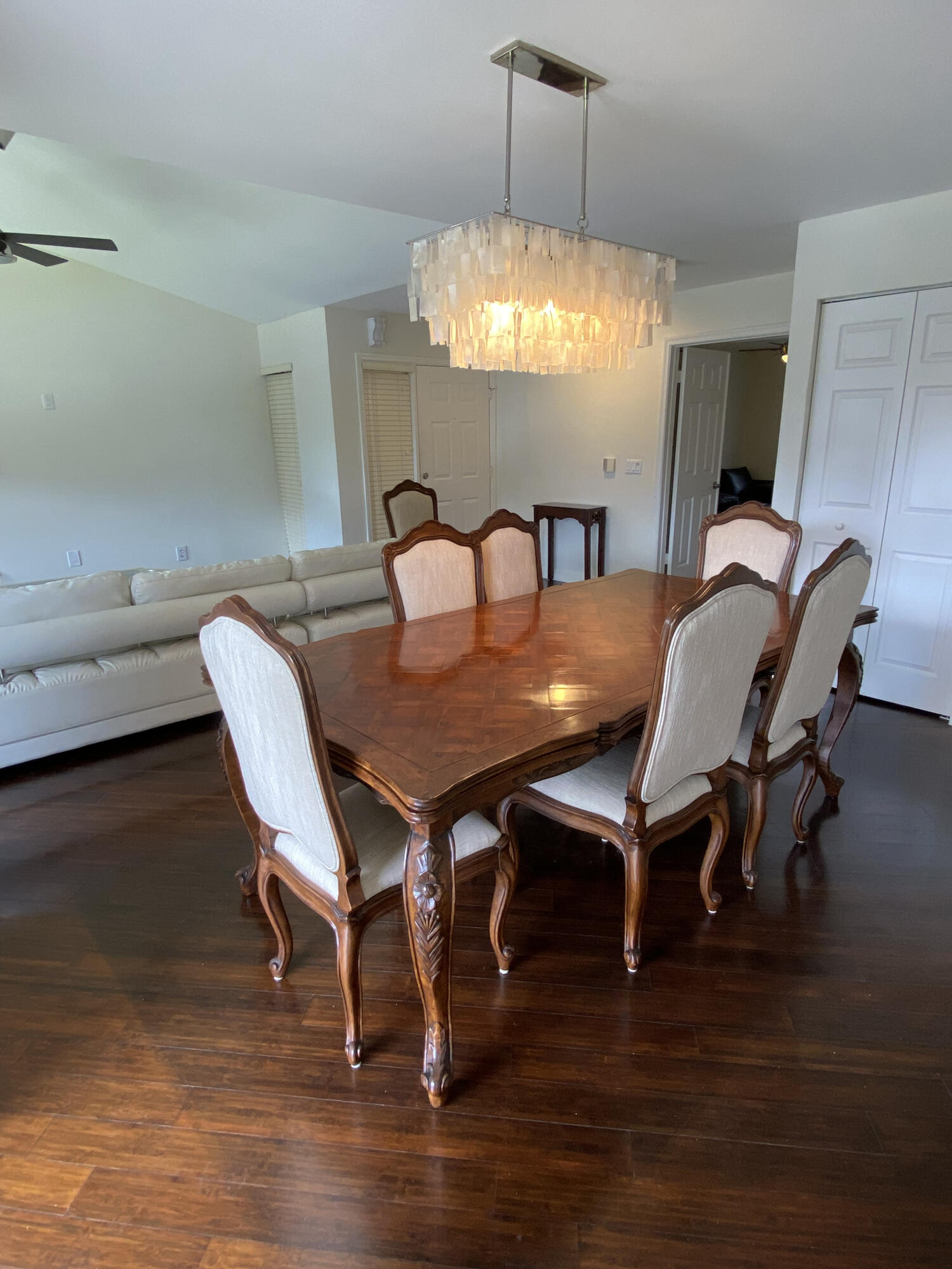 5621 Coach House Circle, Unit D Boca Raton, FL 33486 - Photo 12 of 29 a view of a dining room with furniture window and wooden floor