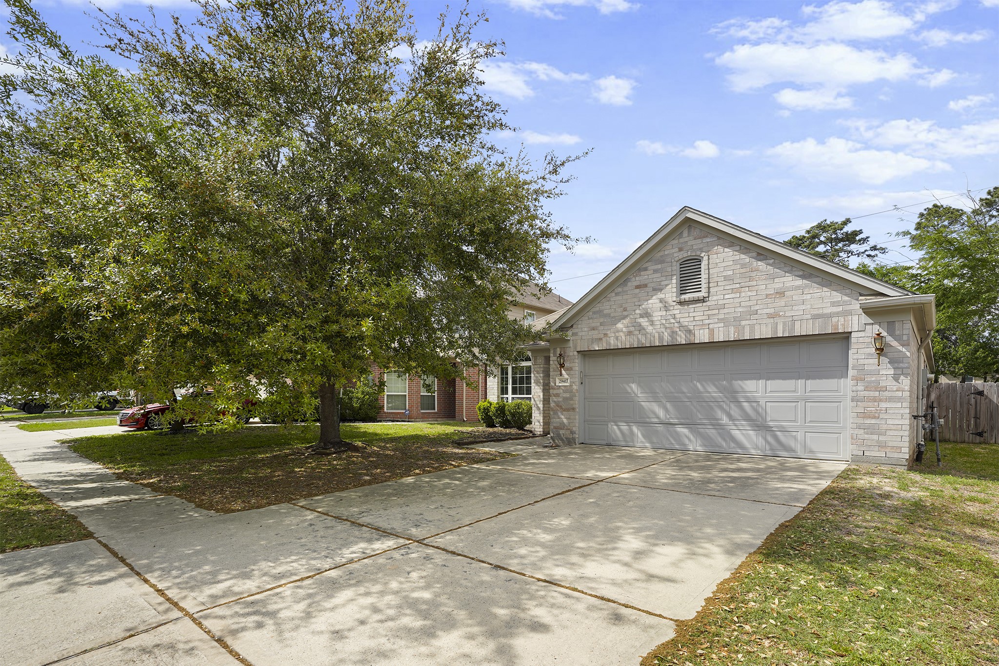 29417 Forest Floor Lane Spring, TX 77386 - Photo 1 of 25 a front view of a house with a garden