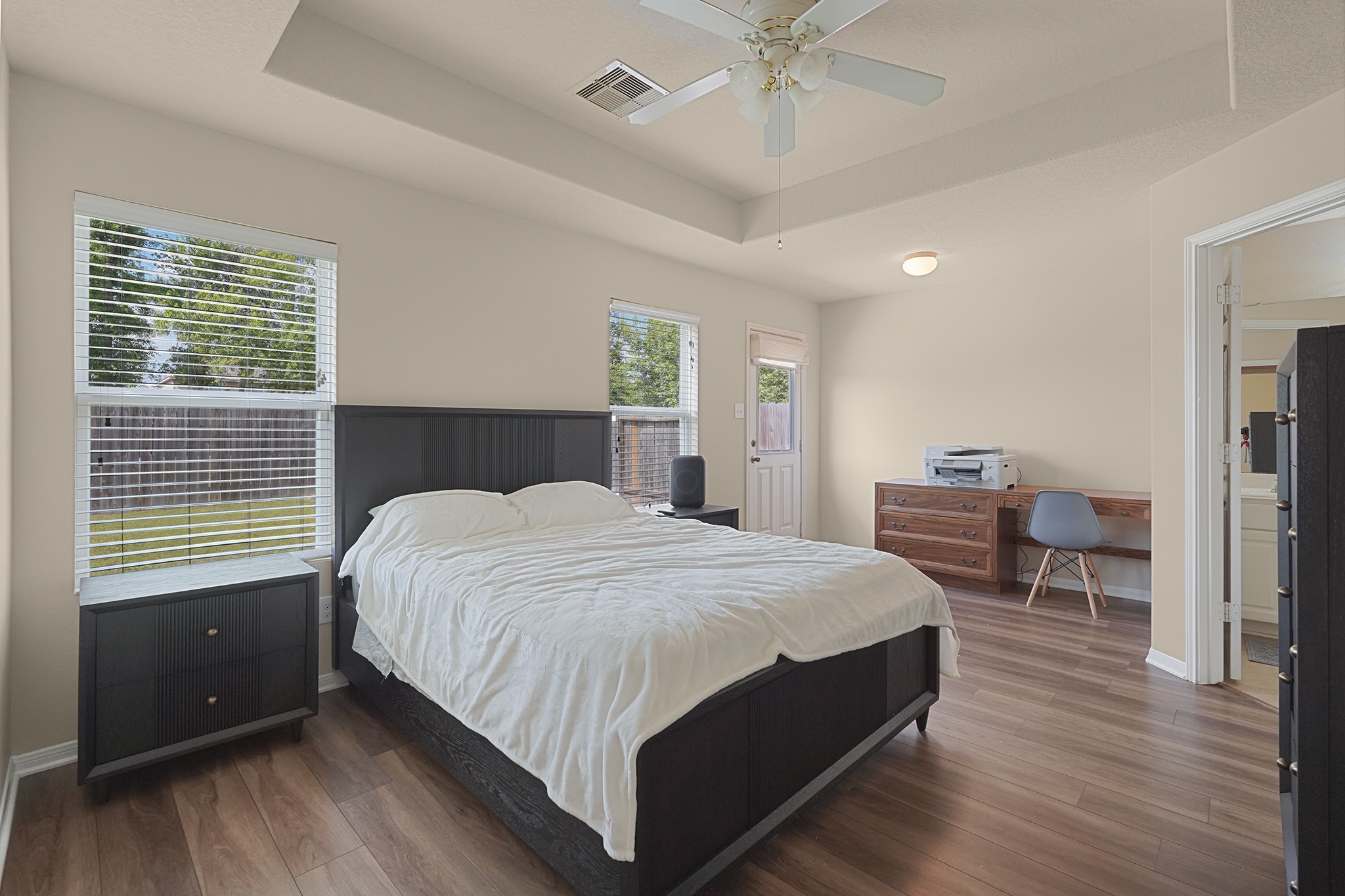 29417 Forest Floor Lane Spring, TX 77386 - Photo 16 of 25 a bedroom with a large bed and a chandelier