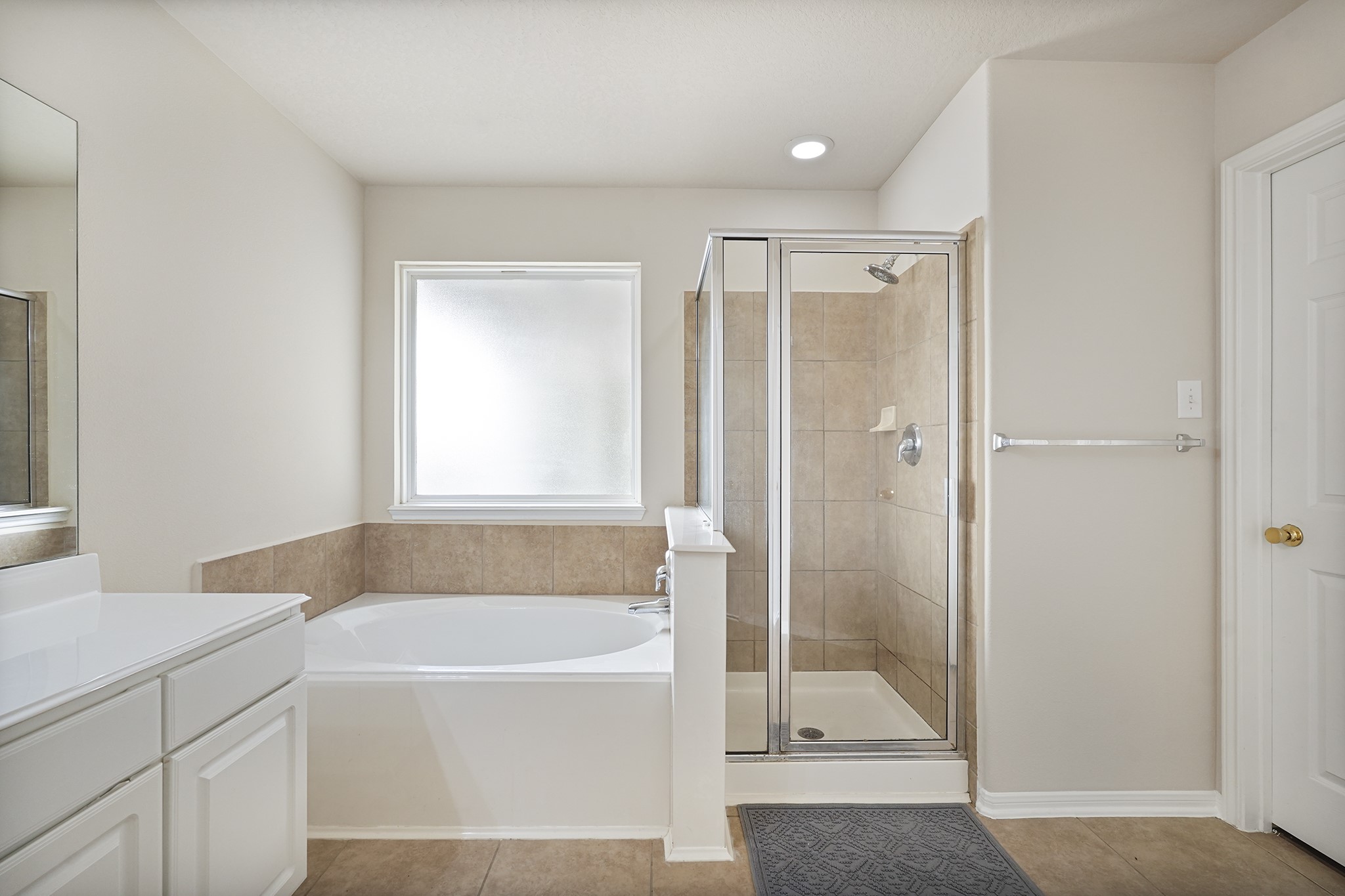 29417 Forest Floor Lane Spring, TX 77386 - Photo 20 of 25 a bathroom with a bathtub and a shower