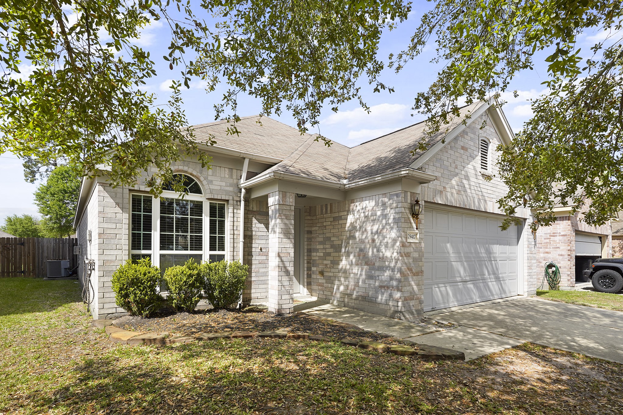 29417 Forest Floor Lane Spring, TX 77386 - Photo 2 of 25 a front view of a house with garden