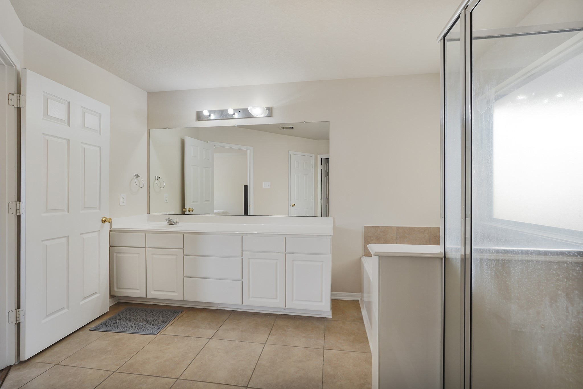 29417 Forest Floor Lane Spring, TX 77386 - Photo 21 of 25 a spacious bathroom with a mirror and a shower