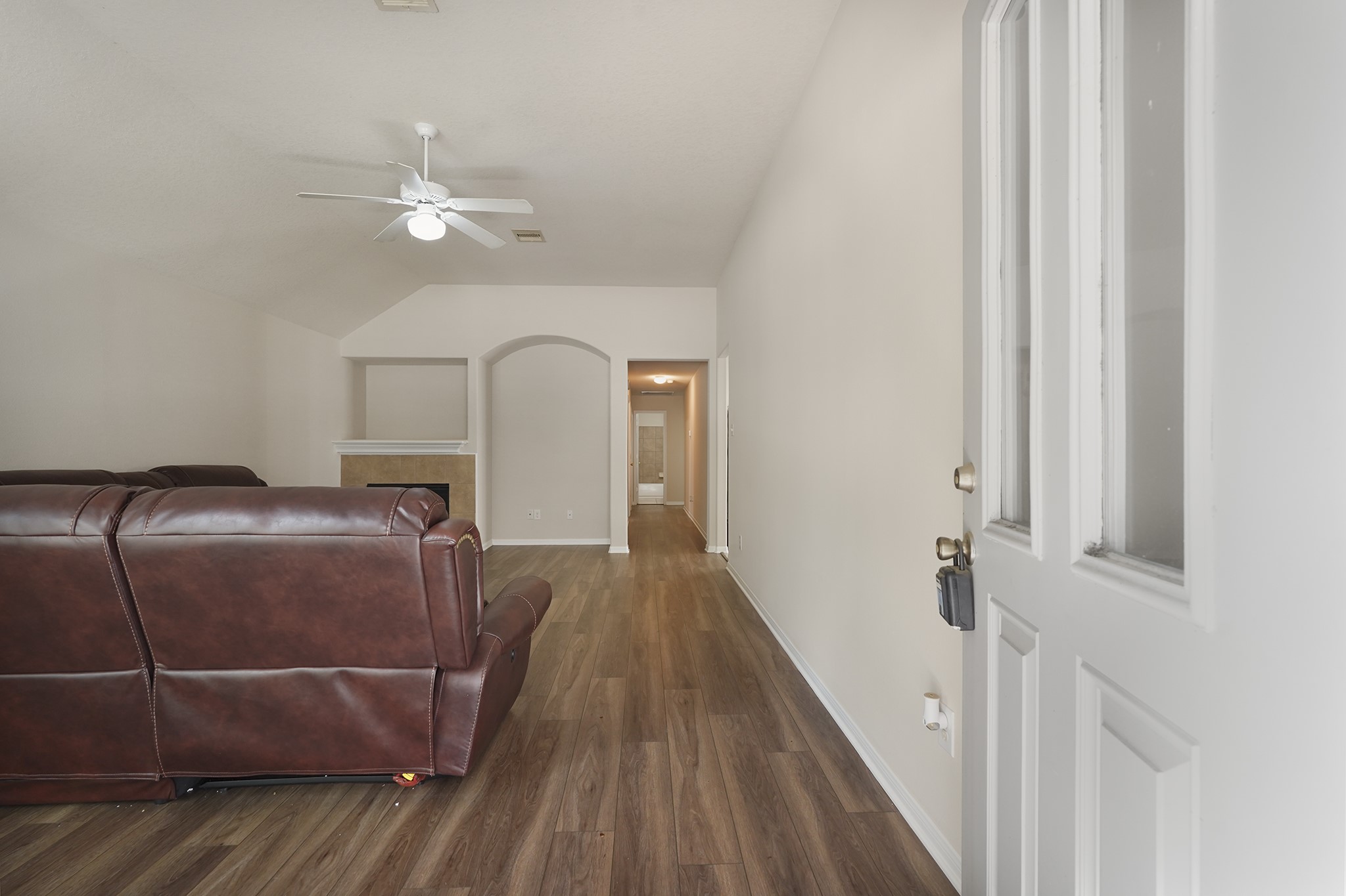 29417 Forest Floor Lane Spring, TX 77386 - Photo 4 of 25 a view of a livingroom with wooden floor and white walls