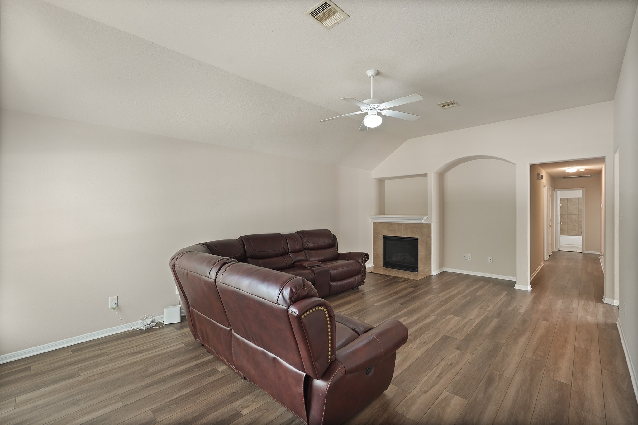 29417 Forest Floor Lane Spring, TX 77386 - Photo 5 of 25 a living room with furniture fireplace and wooden floor