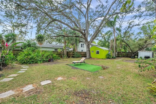 a view of a park with a tree