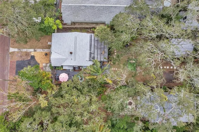 an aerial view of a house with yard and outdoor space