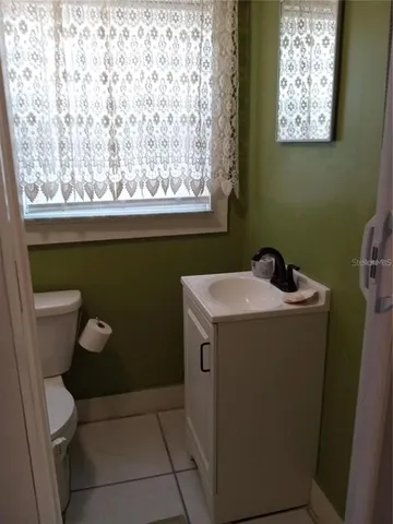 a bathroom with a shower and toilet