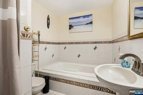 a bed room with a bed and a window