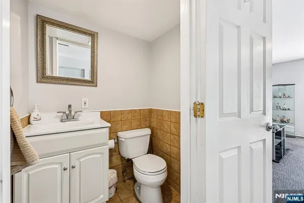 a kitchen with a table chairs and refrigerator