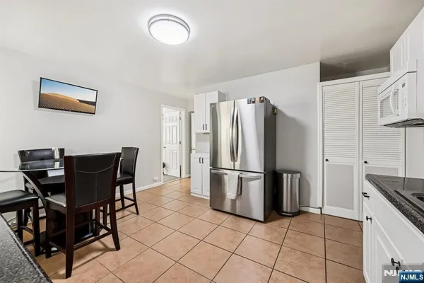 a bathroom with a sink a toilet and a shower