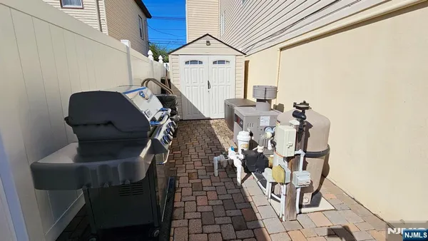 a view of swimming pool with sitting area