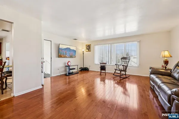 a view of a livingroom with hardwood floor and a couch