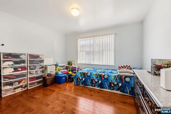 a bedroom with a bed and a chair