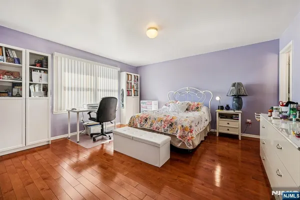 a bathroom with a sink a toilet and shower curtain